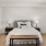 Spacious well lit bedroom with ceiling fan and light