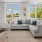 Spacious living room with large windows overlooking East Boston