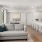 Spacious well lit living room with large windows