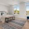 Spacious and well lit bedroom with large windows overlooking East Boston