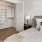 Large well lit bedroom with walk in closet