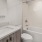 Large and well lit bathroom with large mirror
