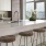 Beautiful naturally lit kitchen with a island and large windows overlooking the Boston Bay.